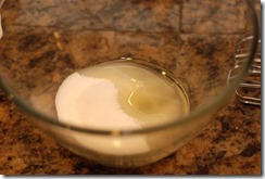 Beat olive oil and white sugar until well-blended