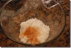 Add vanilla and almond extract and blend again